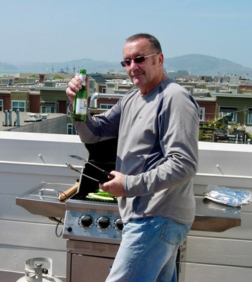 John loved manning the BBQ overlooking the San Francisco Bay from the rooftop!