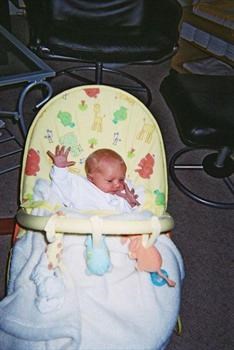 Our darling Christopher in his bouncer, long fingers, just like his mummy x x x x