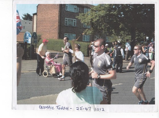 Mum at the Olympics 2012 - well waving at the torch bearers outside Sudbury Neighbourhood Centre