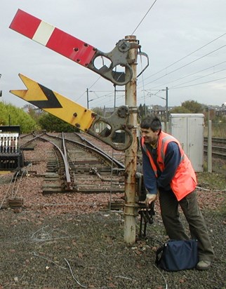 David testing his strength during a visit to the Scottish railway signalling training centre  in 2006.