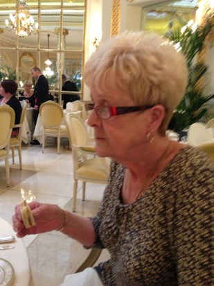 Mum tucking into one of the lovely sandwiches at "The Ritz"