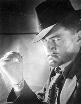John self-portrait posing as Harry Lime ala Orson Welles in The Third Man