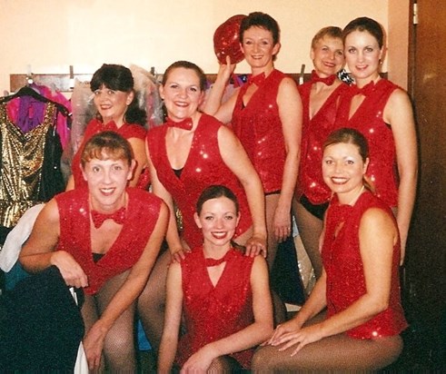 BMSD group in red sequinned waistcoats