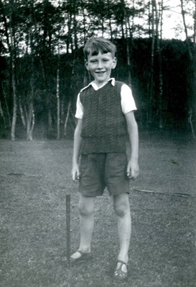 A young Dan playing cricket