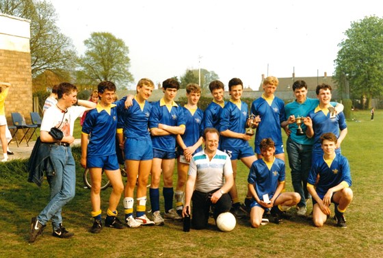 Football Spring 1987.  steven on far right with his dad holding ball