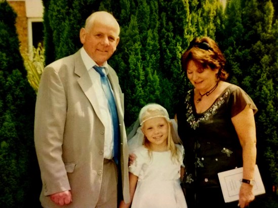 Dad,Adreanna and Mum at Adreanna's first holy communion at the Sacred Heart church, Sunningdale 