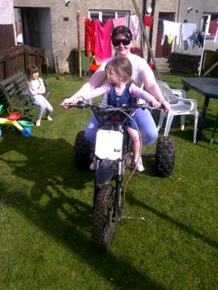 mummy and caitlin on uncle Stuart's dirtbike