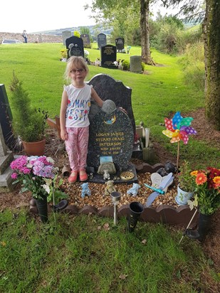 Logan's grave with the rainbow baby Olivia rose 