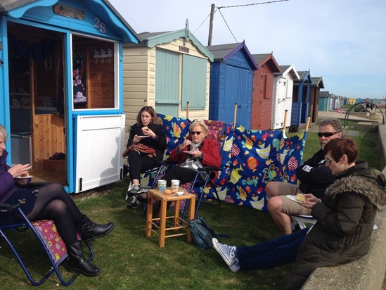 Everyone Stuffing cake at the beach hut