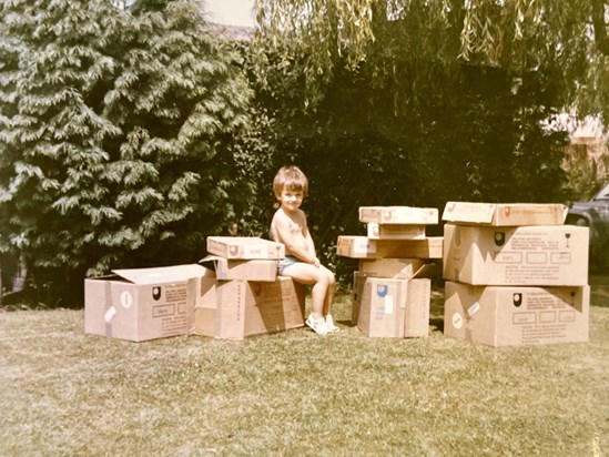 (Shared by Jef's Dad) Jef's associations with the OU go right back to his earliest days. Here, he's surrounded by boxes of OU materials, a common sight in the family home and garden growing up. 