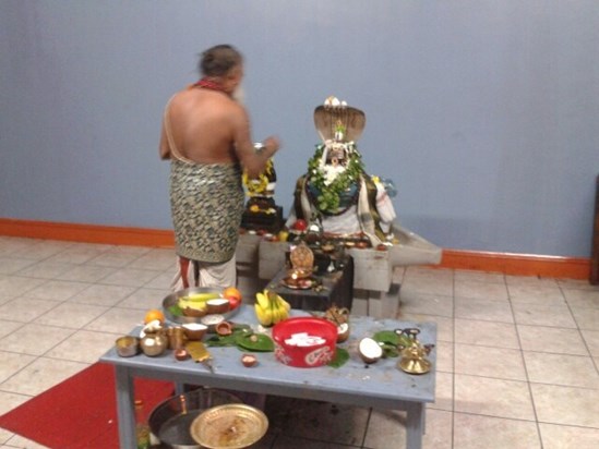 On his first anniversary- Kovil chief doing mocha archanai in murugan temple- 13/01/.2014