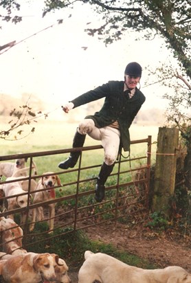 Dad jumping over gate