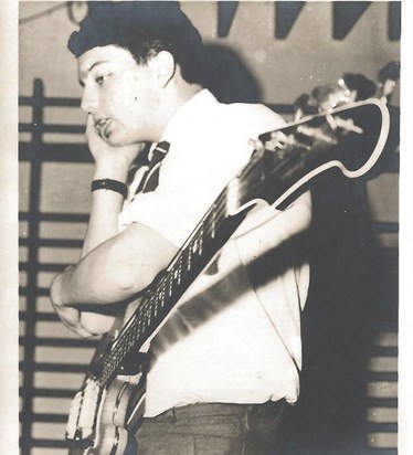 George playing guitar
