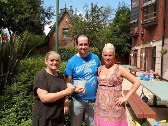 Handing over the cheque for £1525 to Denise at Ronald McDonald House