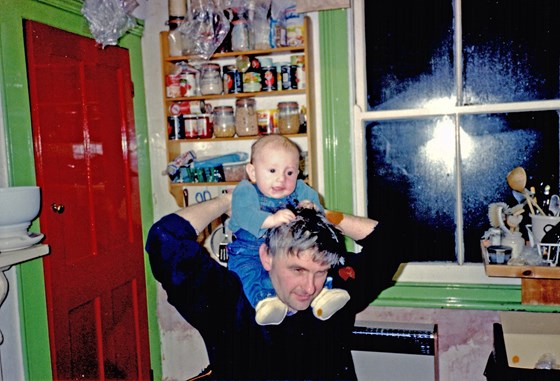 Don with Sam on shoulders in Forest Gate kitchen.