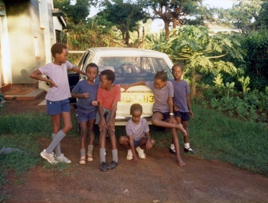 Alex(in red tshirt) with his pals during his younger years