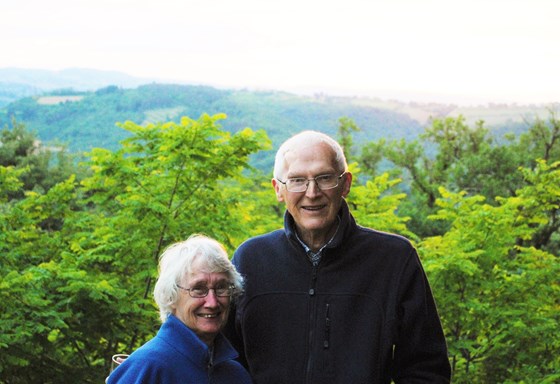 Hazel and Les in Tuscany, looking out over San Giminiano