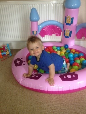 Enjoying his pink ball pit at nannas