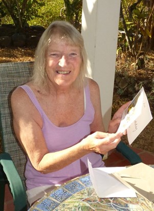 Rosie opening birthday cards in Tobago, 2019